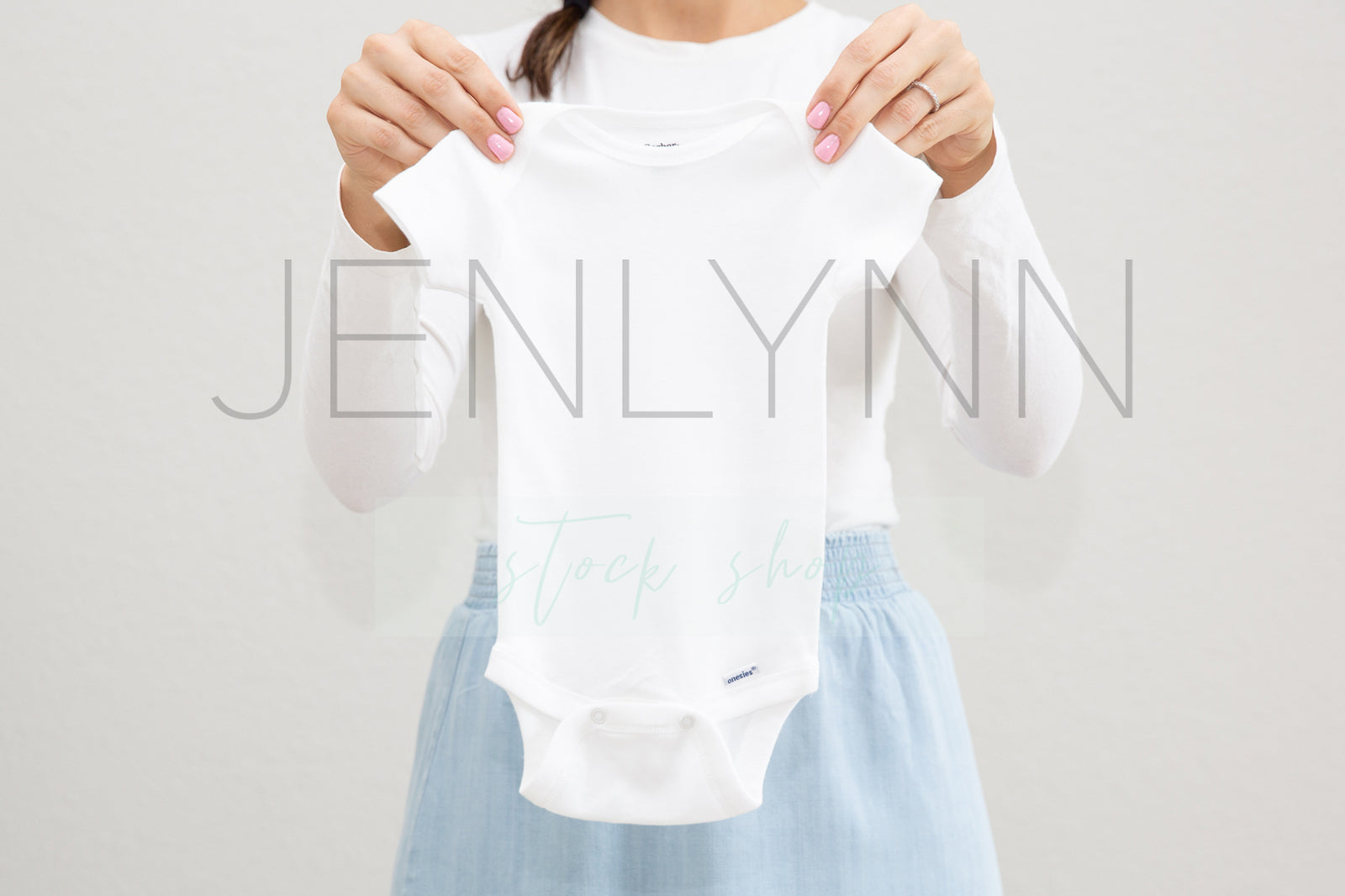 Woman Holding White Onesie Mockup #6 JPG