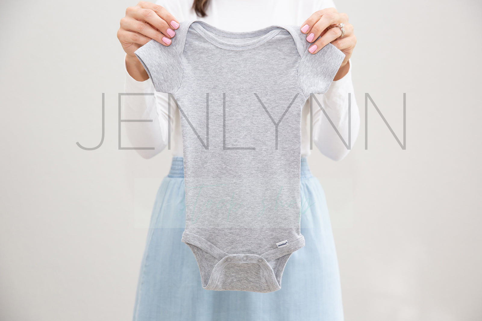 Woman Holding Grey Onesie Mockup #7 JPG